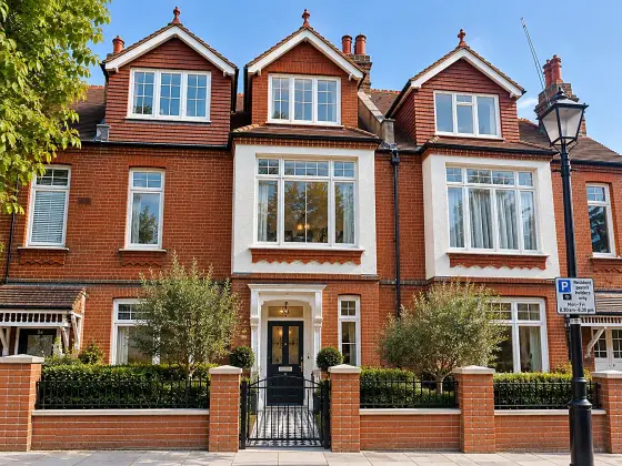 The finished house after a Suddeco refurbishment: restored brickwork, new windows and landscaped frontage
